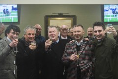 CONNECTIONS OF RIDERS ONTHE STORM CELEBRATE IN THE BAR AFTER WINNING. TRAINER,NIGEL TWISTON-DAVIES SECOND LEFT WITH SON WILLIE LEFT.ASCOT 15-2-20.Photo © George Selwyn +44 (0)7967 030722116 Wellington Parade Kent UK CT14 8AF.