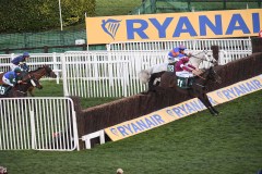 MILAN NATIVE (11) JUMPS THE LAST FENCE WITH GREY, KILFILUM CROSS ON WAY TO WINNING.CHELTENHAM 12-3-20.Photo © George Selwyn +44 (0)7967 030722116 Wellington Parade Kent UK CT14 8AF.