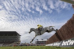 POLITILOGUE LEADS  JUMPING THIRD FENCE ON WAY TO WINNING.CHELTENHAM 11-3-20.©George Selwyn  07967 030722 email: george@georgeselwyn.co.uk Vat no:3308110 05