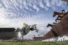 POLITILOGUE LEADS DYNAMITE DOLLARS AND BUN DORAN (RIGHT) JUMPING THIRD FENCE ON WAY TO WINNING.CHELTENHAM 11-3-20.©George Selwyn  07967 030722 email: george@georgeselwyn.co.uk Vat no:3308110 05