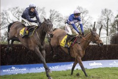 SAM TWISTON-DAVIES RIDING RIDERS ONTHE STORM, (LEFT)  WITH CYRNAME  JUMPING THE 4TH LAST FENCE ON WAY TO WINNING.ASCOT 15-2-20.Photo © George Selwyn +44 (0)7967 030722116 Wellington Parade Kent UK CT14 8AF.