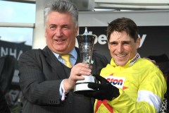 HARRY SKELTON (RIGHT) AND PAUL NICHOLLS WITH CHAMPION CHASE TROPHY.CHELTENHAM 10-3-20.©George Selwyn  07967 030722 email: george@georgeselwyn.co.uk Vat no:3308110 05