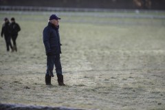 SIR MICHAEL STOUTE WATCHING HIS HORSES ON THE ALL WEATHER GALLOP.NEWMARKET 7.30AM. 6-2-20.Photo © George Selwyn +44 (0)7967 030722116 Wellington Parade Kent UK CT14 8AF.
